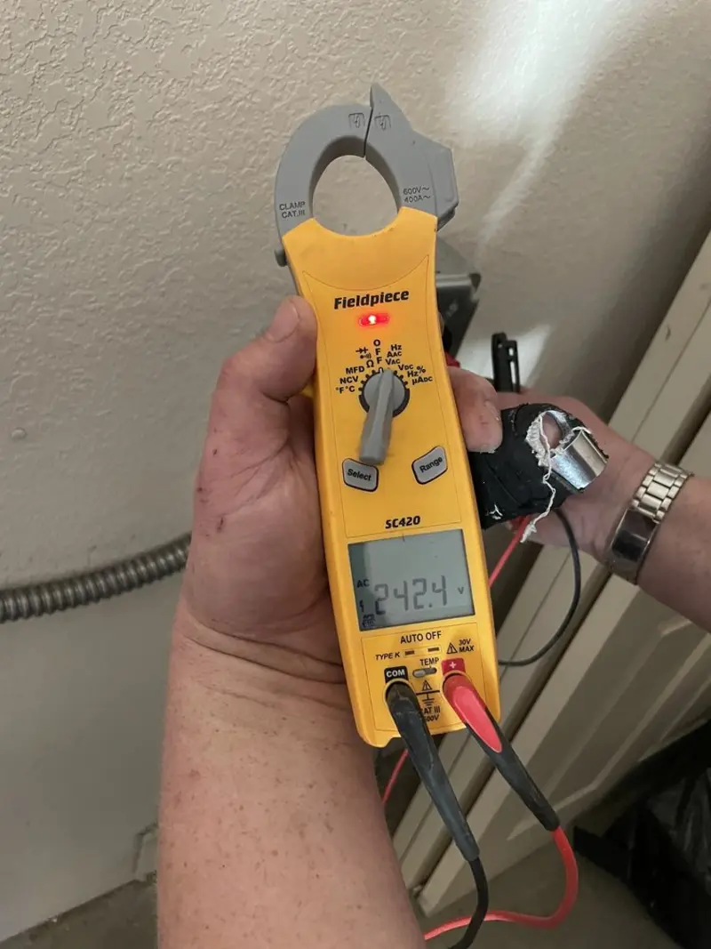 Voltage testing with clamp meter during Recessed Lighting Installation in Fryeburg